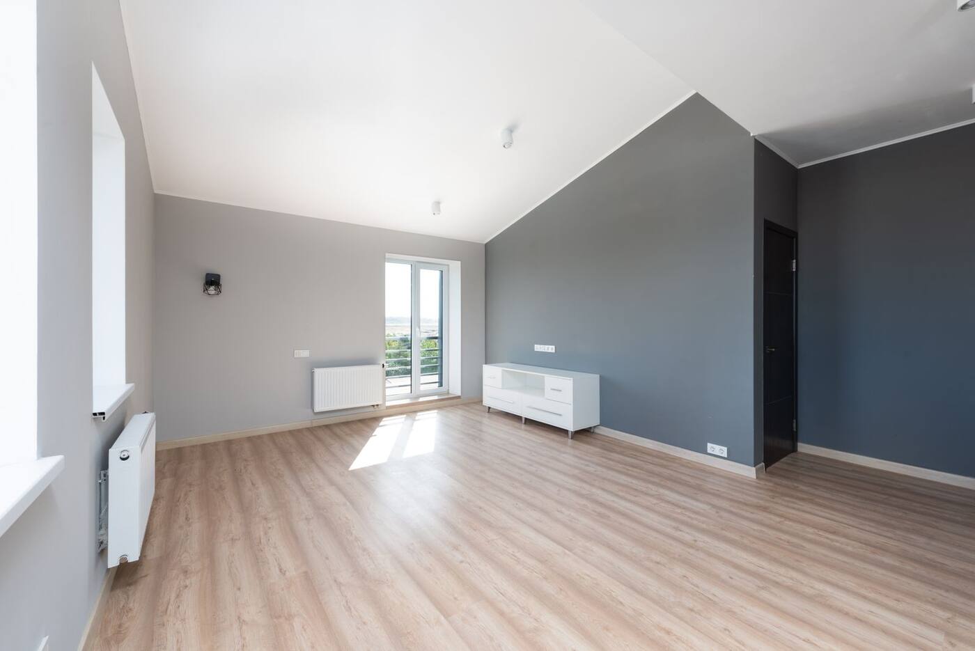 After: the restored living room, with repaired plaster, rebuilt trim and refinished floors.